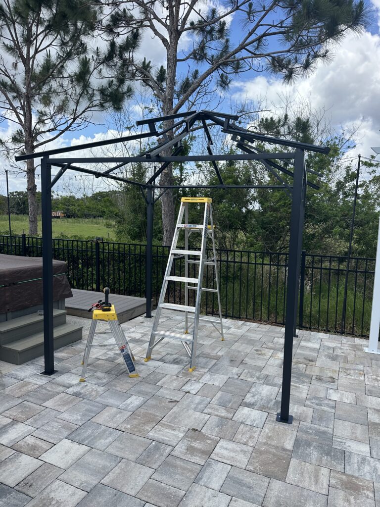 Hardtop gazebo installation in Saint Cloud backyard