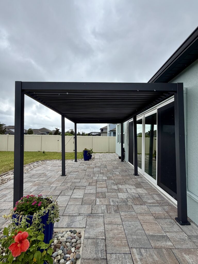 Completed Mirador louvered pergola installation on a paver patio in Oviedo, FL